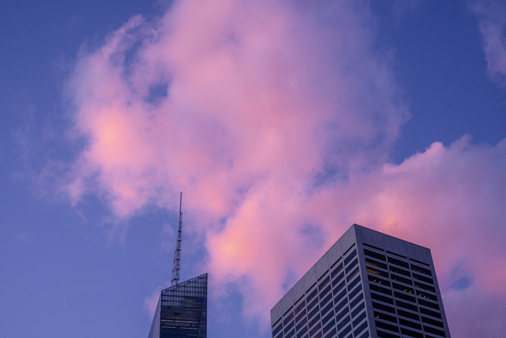 a very tall building sitting next to a very tall building