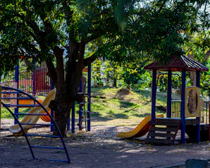 a children's play area with swings and slides