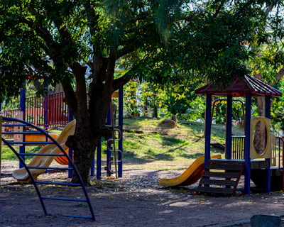 a children's play area with swings and slides