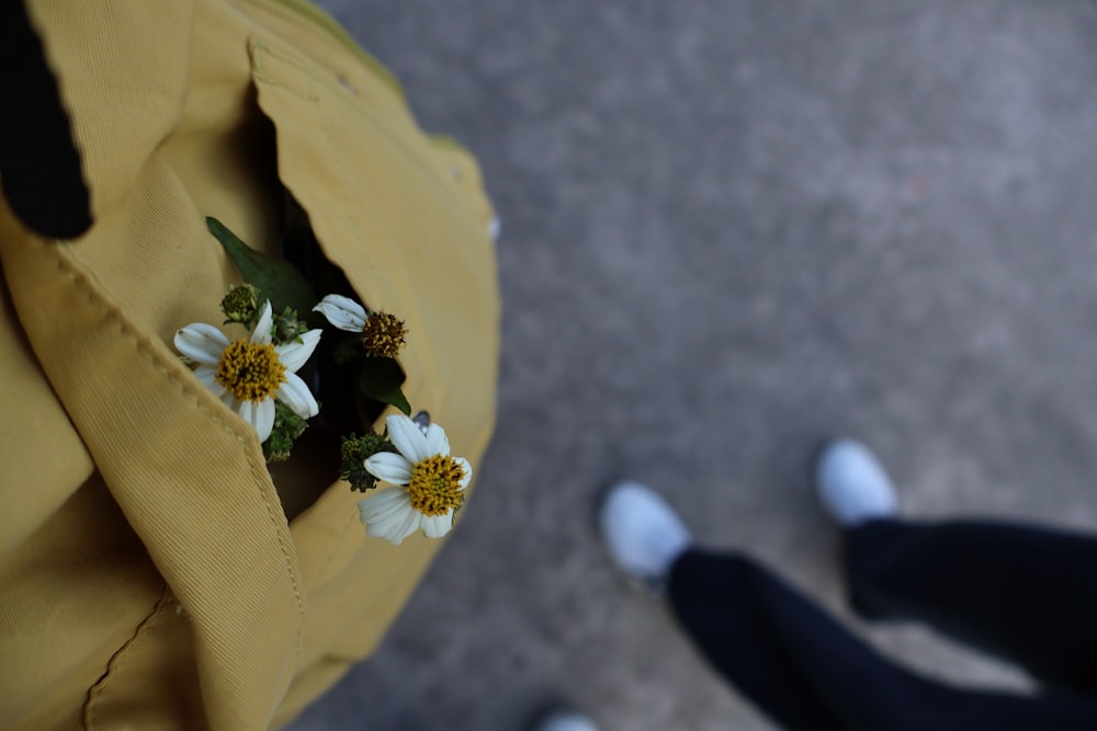 a close up of a bag with flowers in it