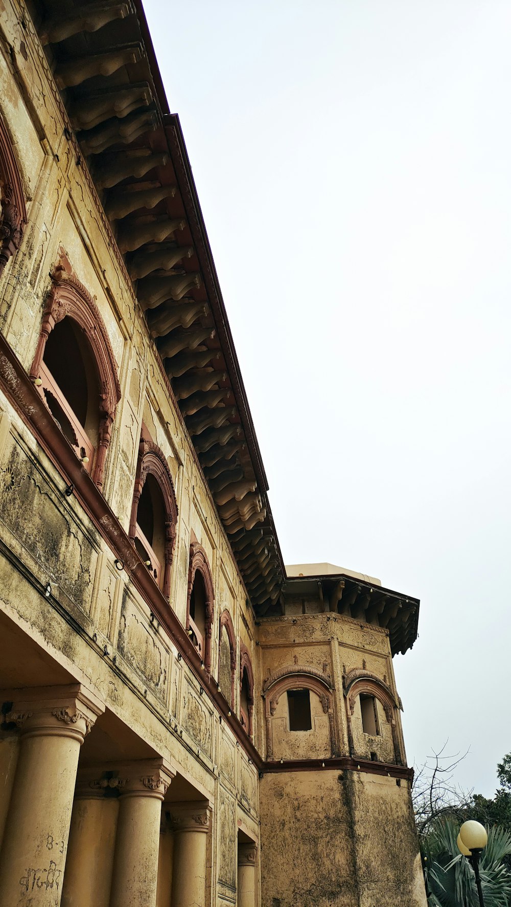 an old building with columns and a clock tower