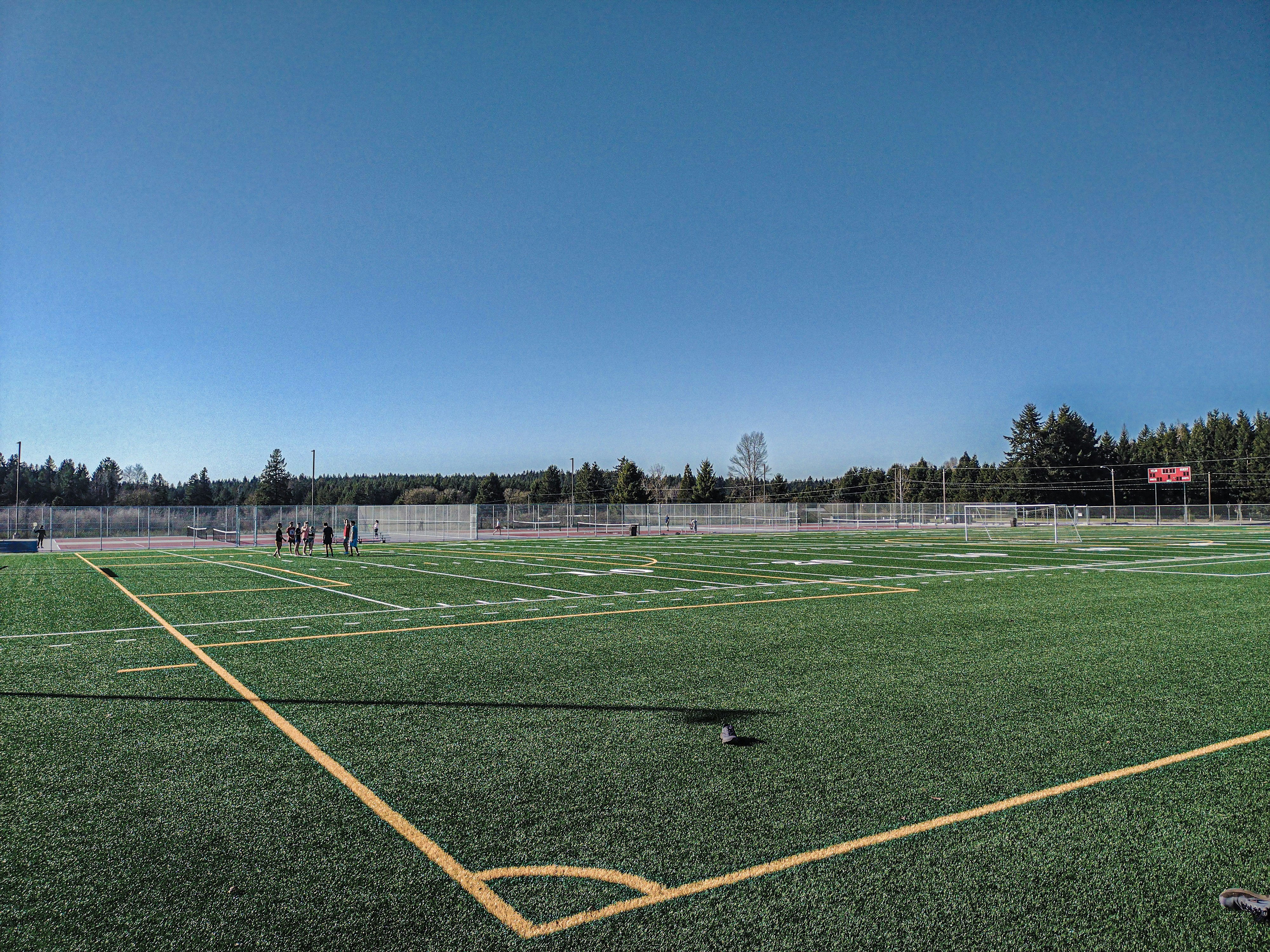a soccer field with a few players on it