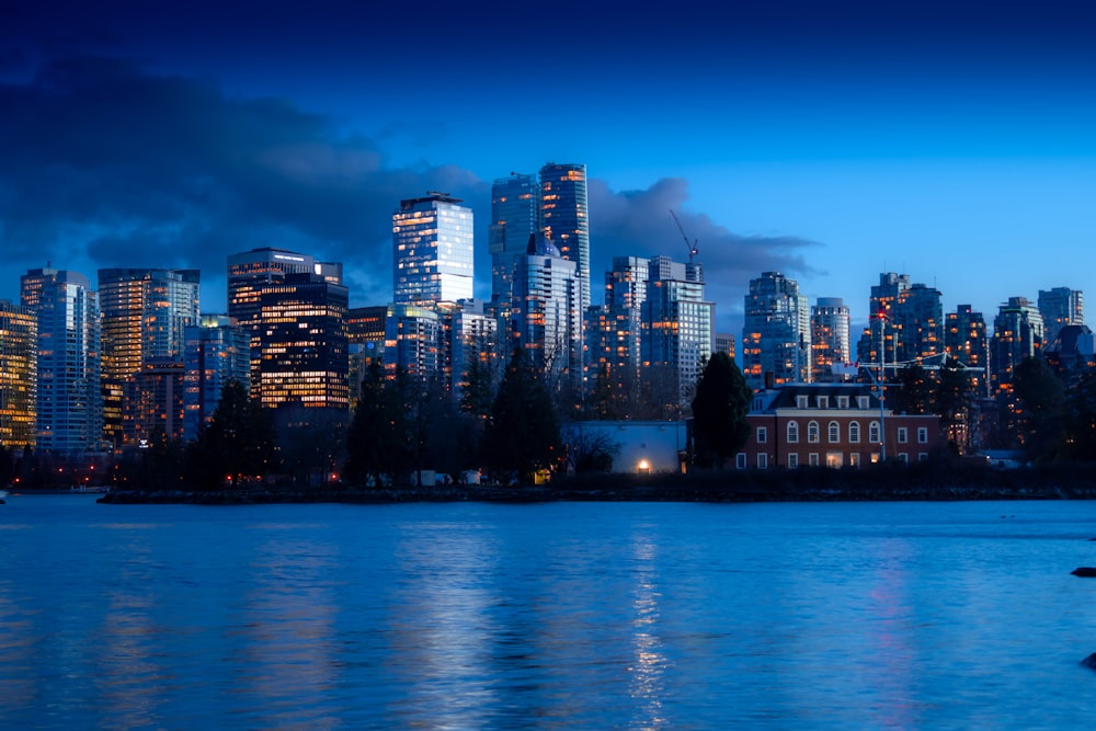 a large body of water with a city in the background