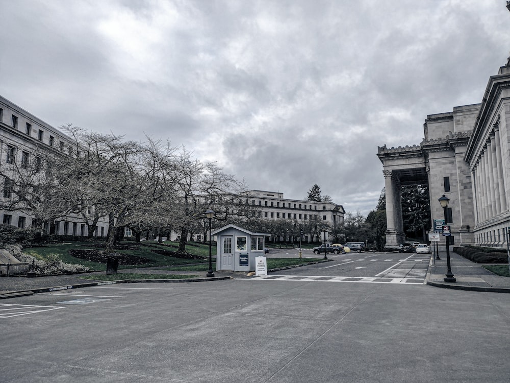 an empty street with a building in the background