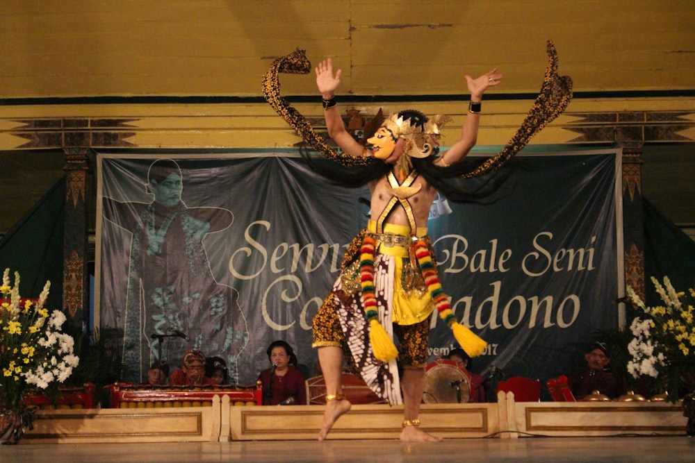 a woman in a costume on a stage