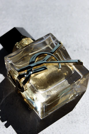 a pair of scissors sitting on top of a glass container