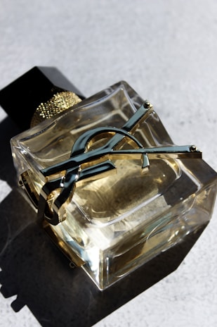 a pair of scissors sitting on top of a glass container