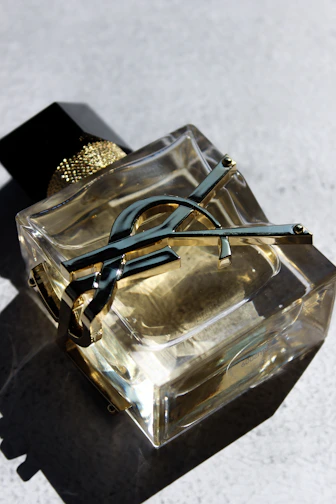a pair of scissors sitting on top of a glass container