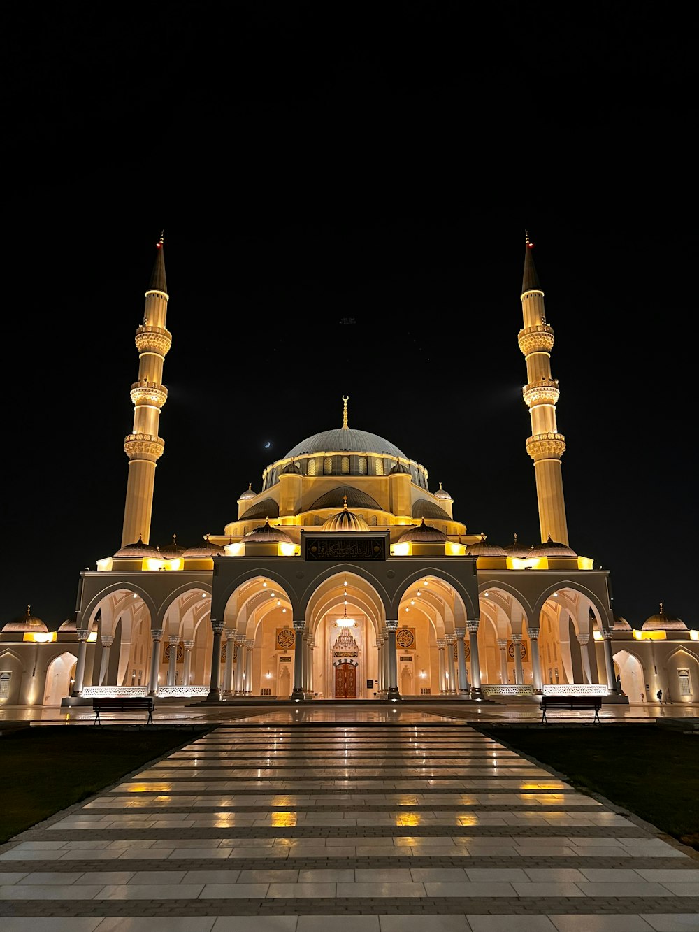 a large building lit up at night with lights