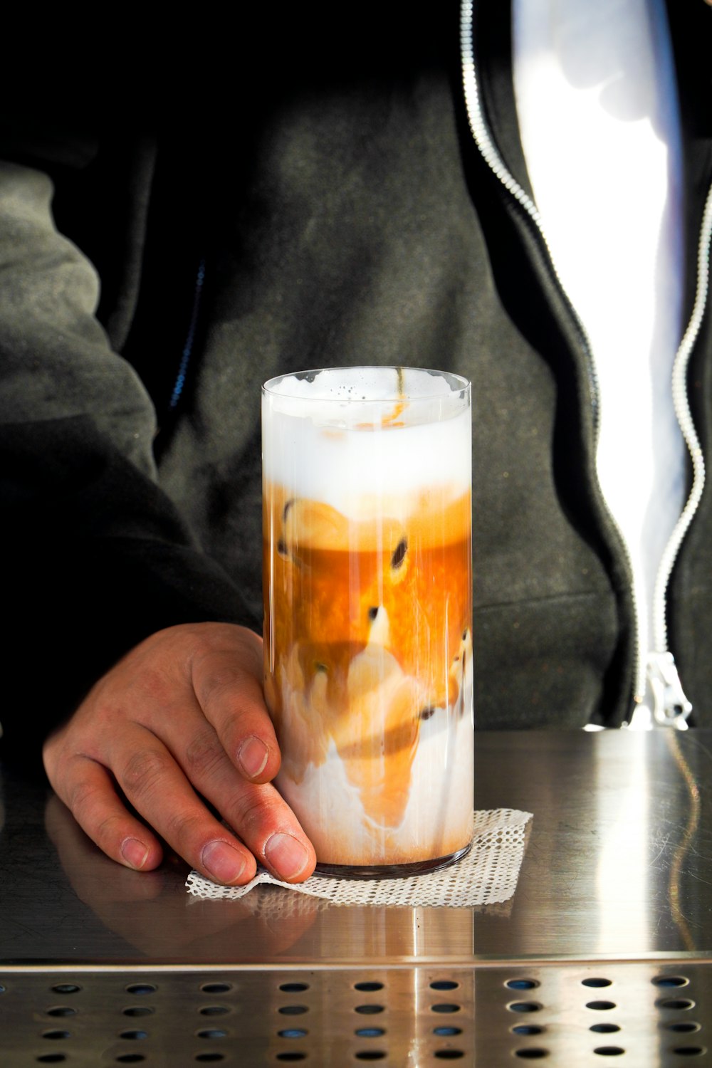 a man holding a glass with a picture of a fox on it