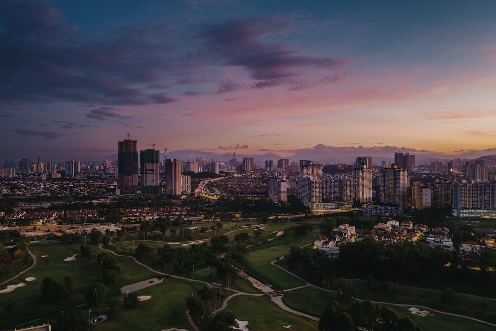 an aerial view of a city at sunset