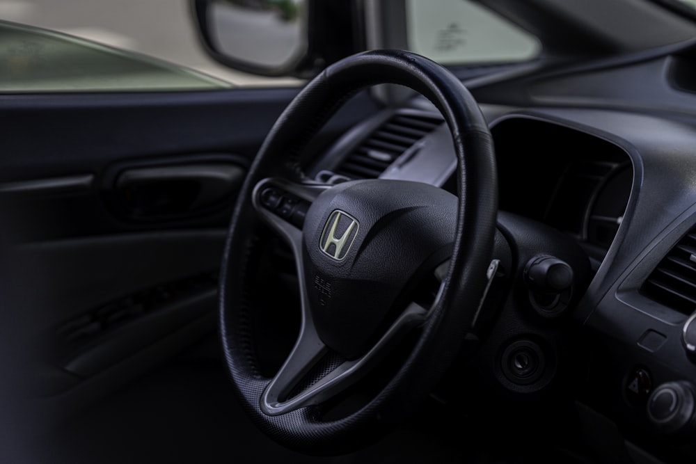 the interior of a car with a steering wheel