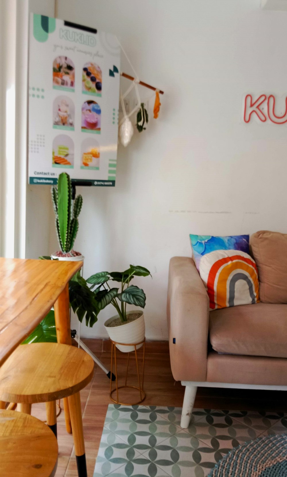 a living room filled with furniture and a wooden table