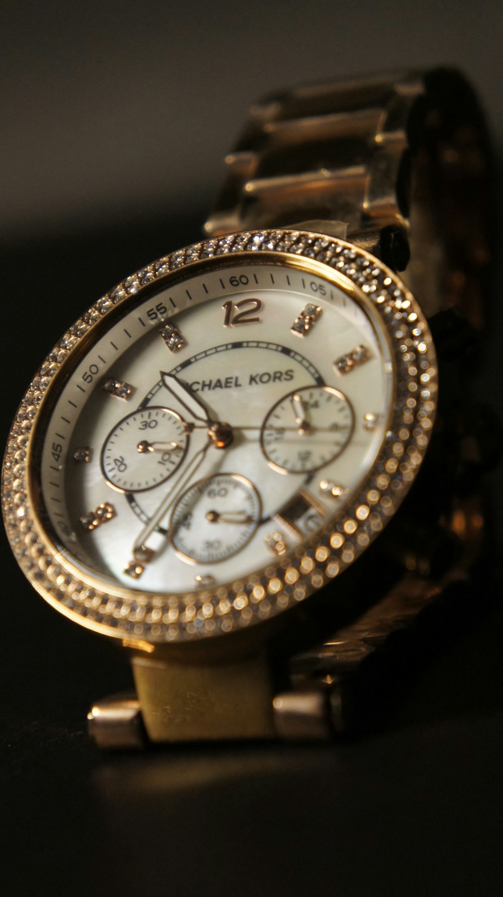 a close up of a watch on a table