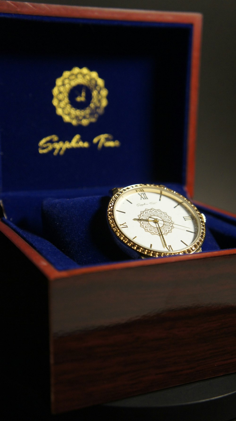a watch sitting inside of a wooden box
