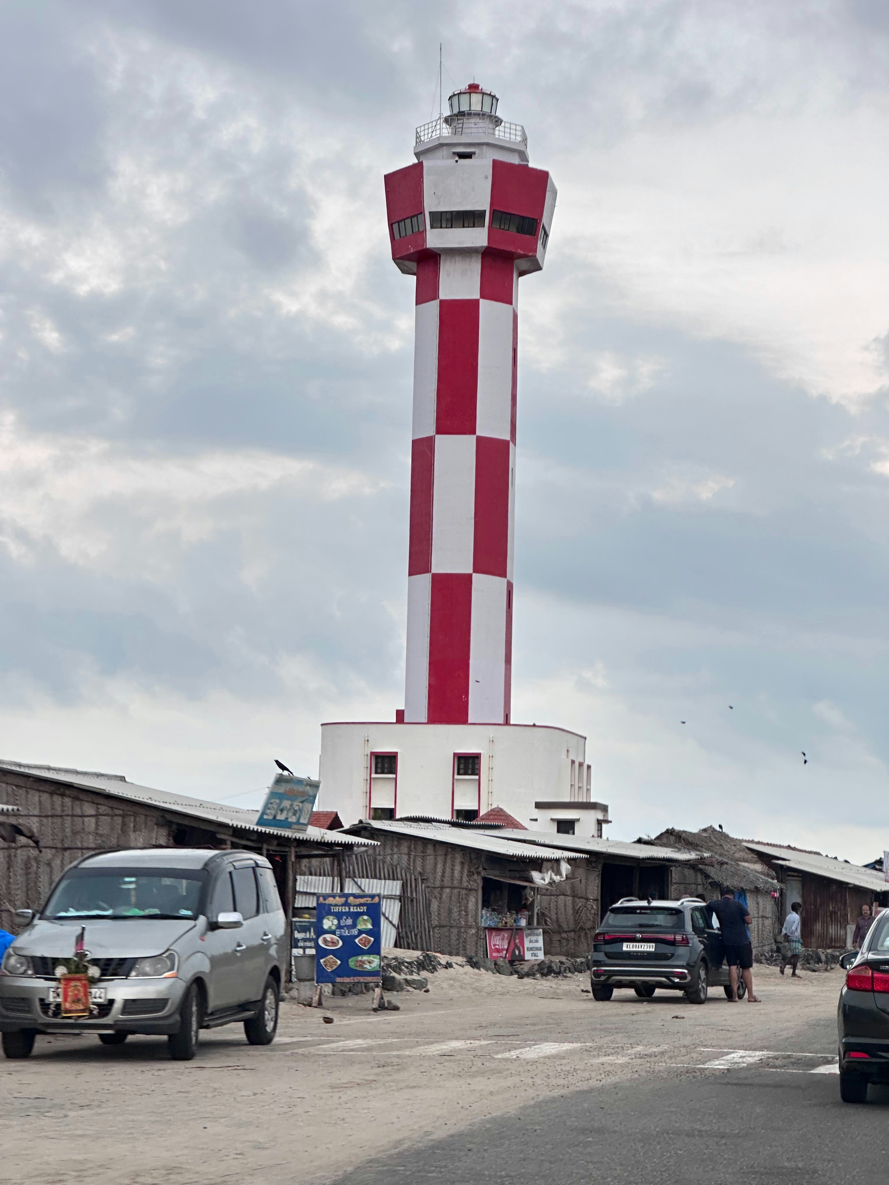 a red and white lighthouse on top of a building