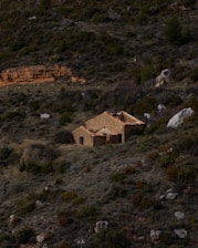 an old house in the middle of a field
