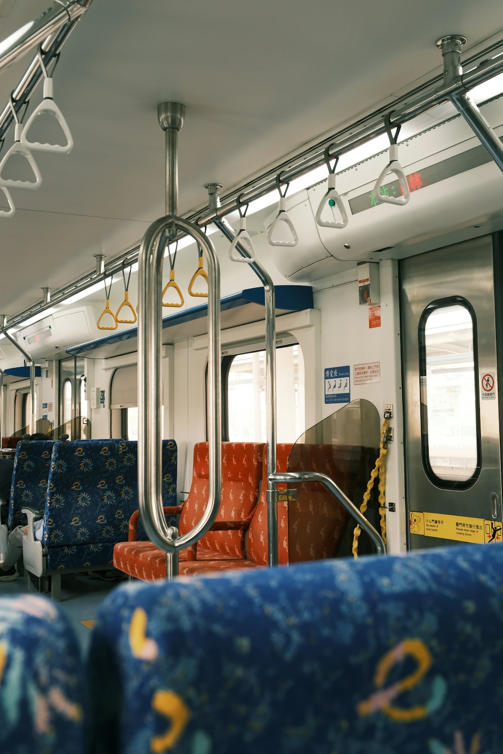 a view of the inside of a subway car