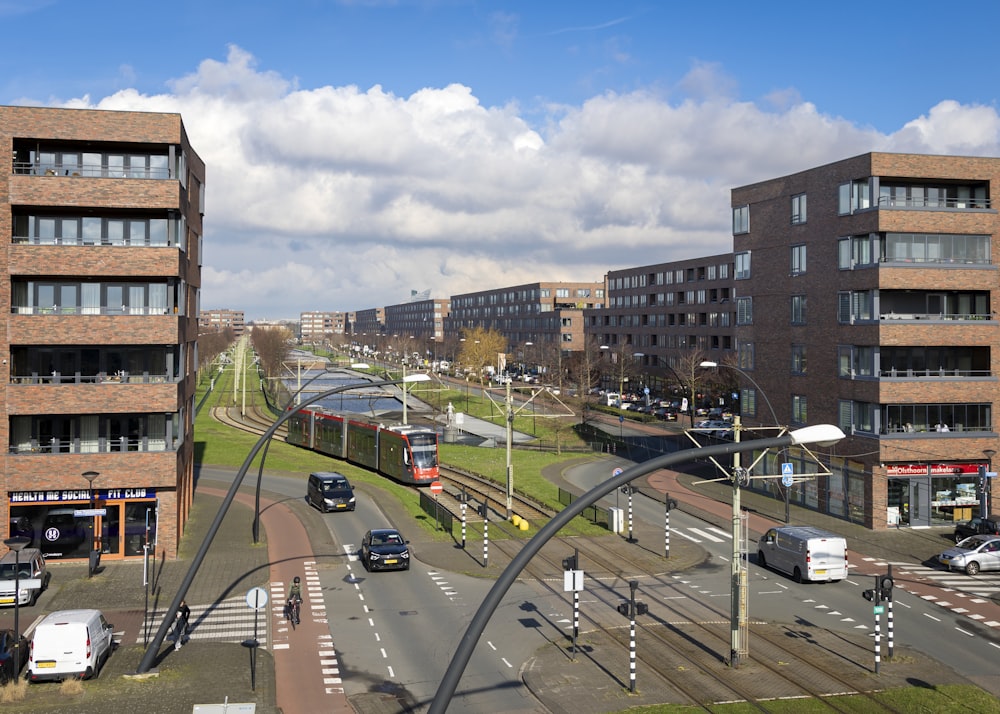 a view of a city street with a train on the tracks