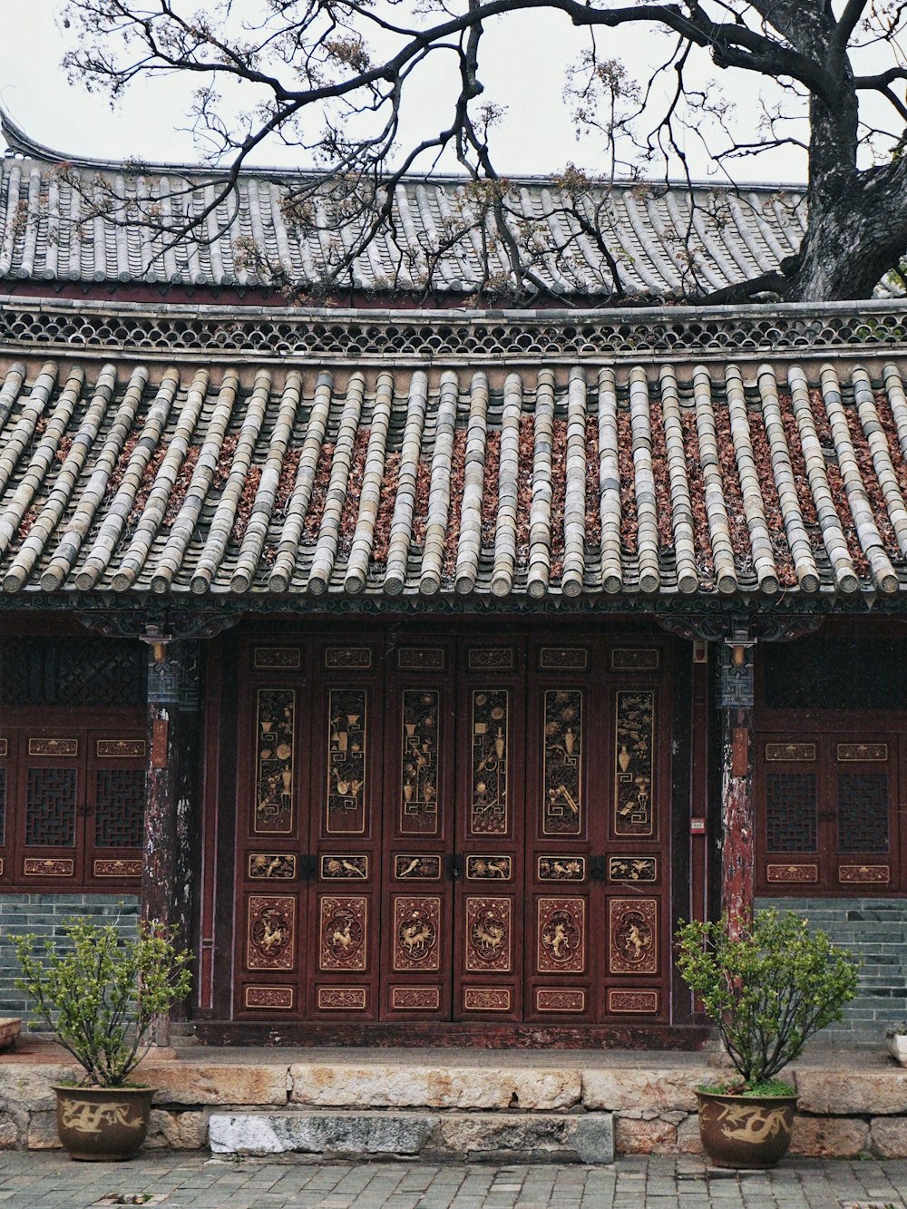 a building with a large wooden door in front of it