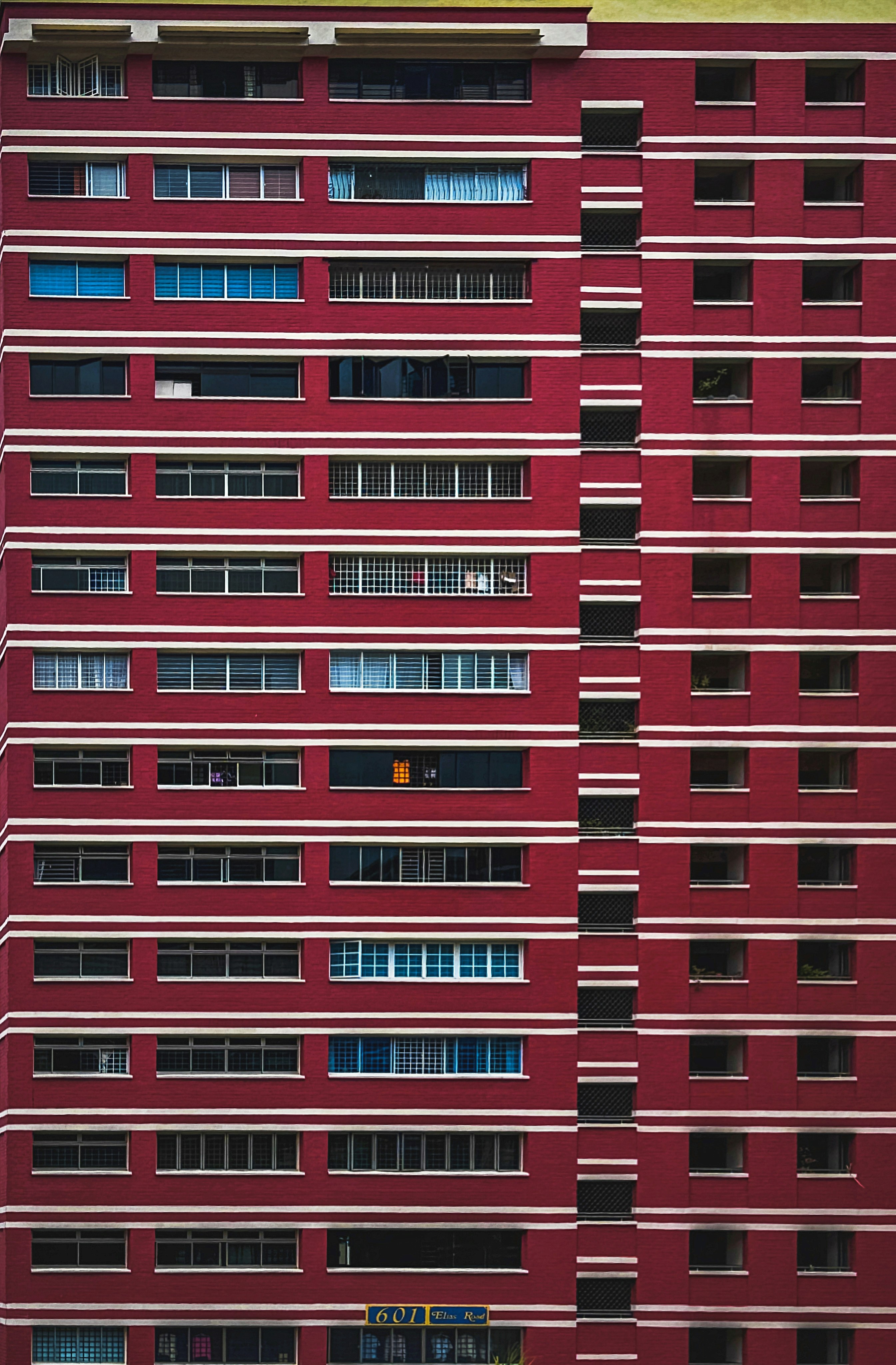a large red building with many windows and balconies