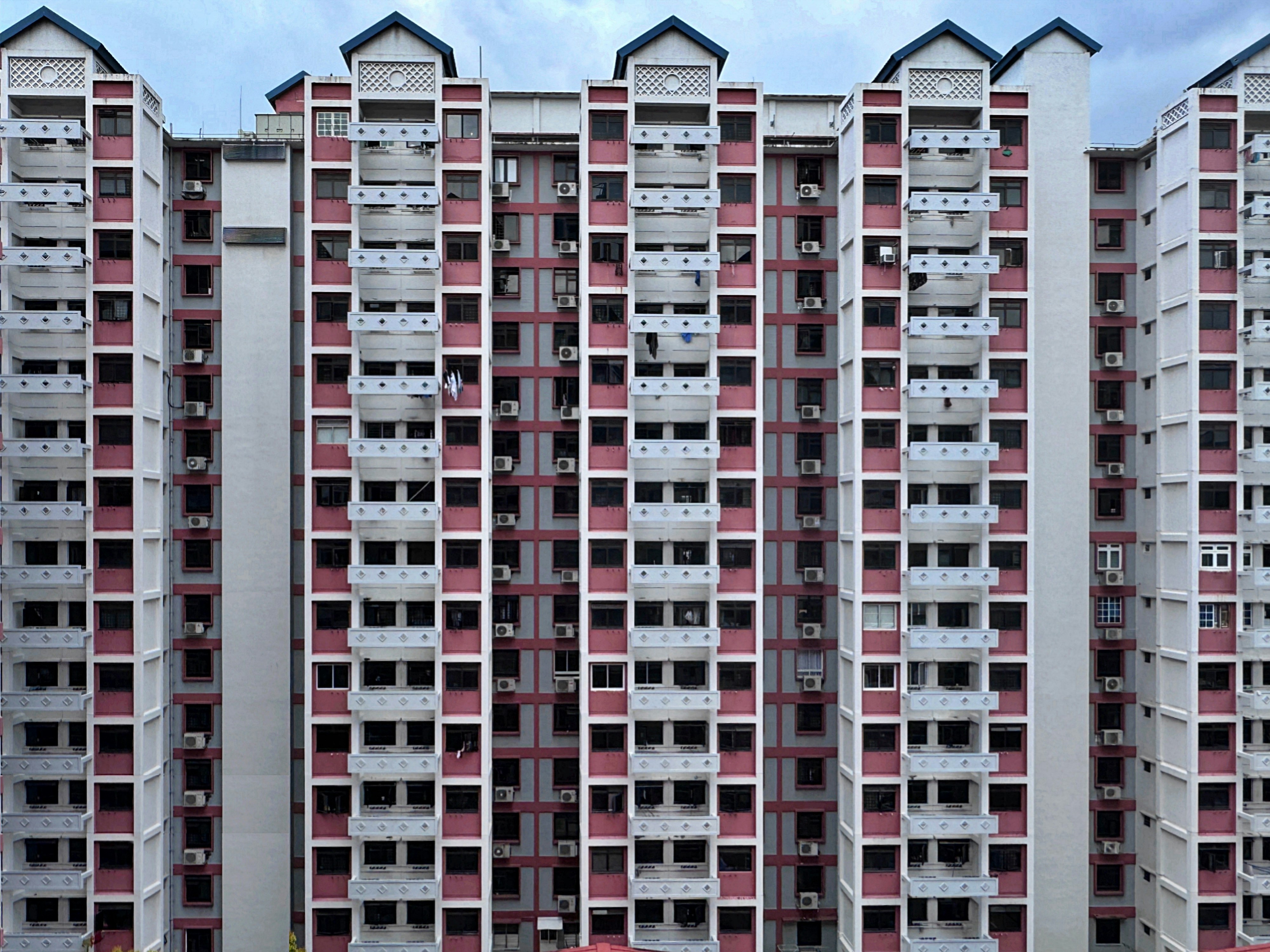 a tall building with balconies and balconies on the windows