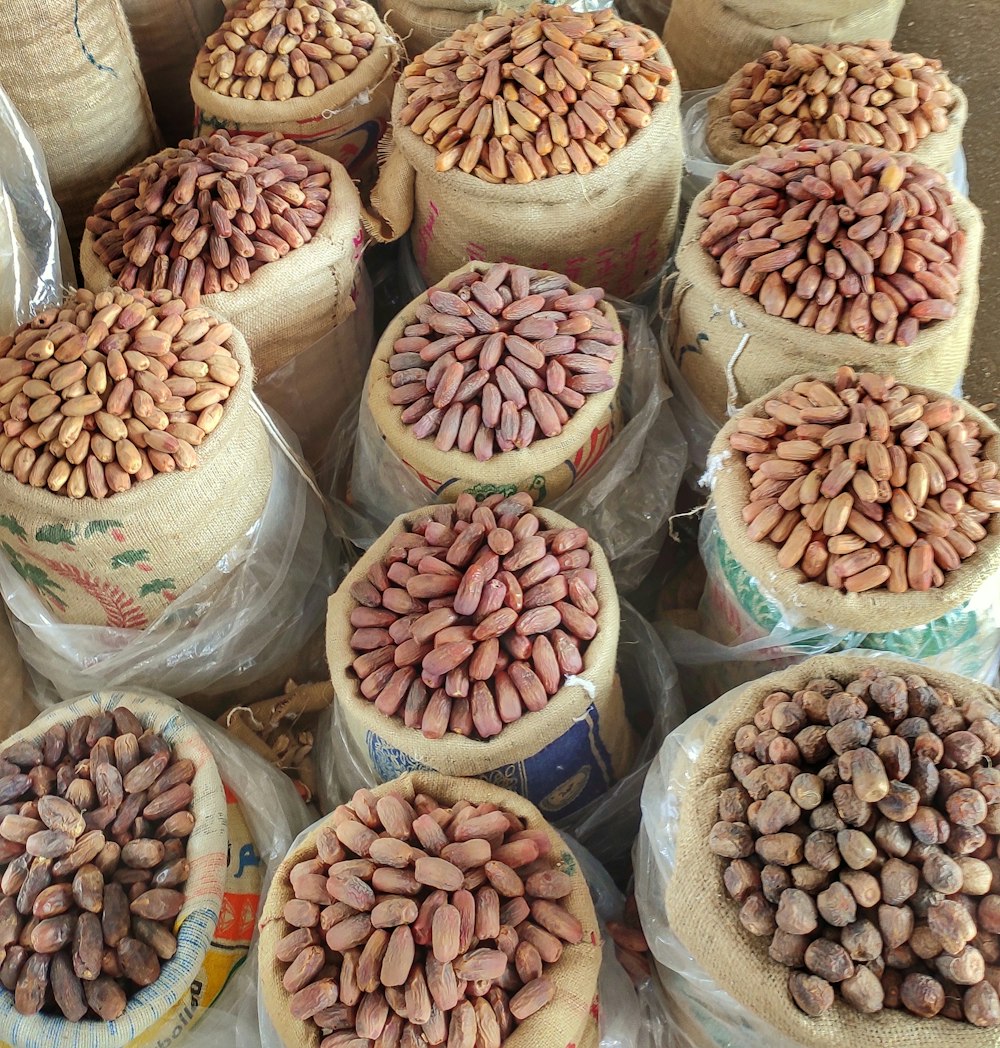 a pile of bags filled with lots of beans