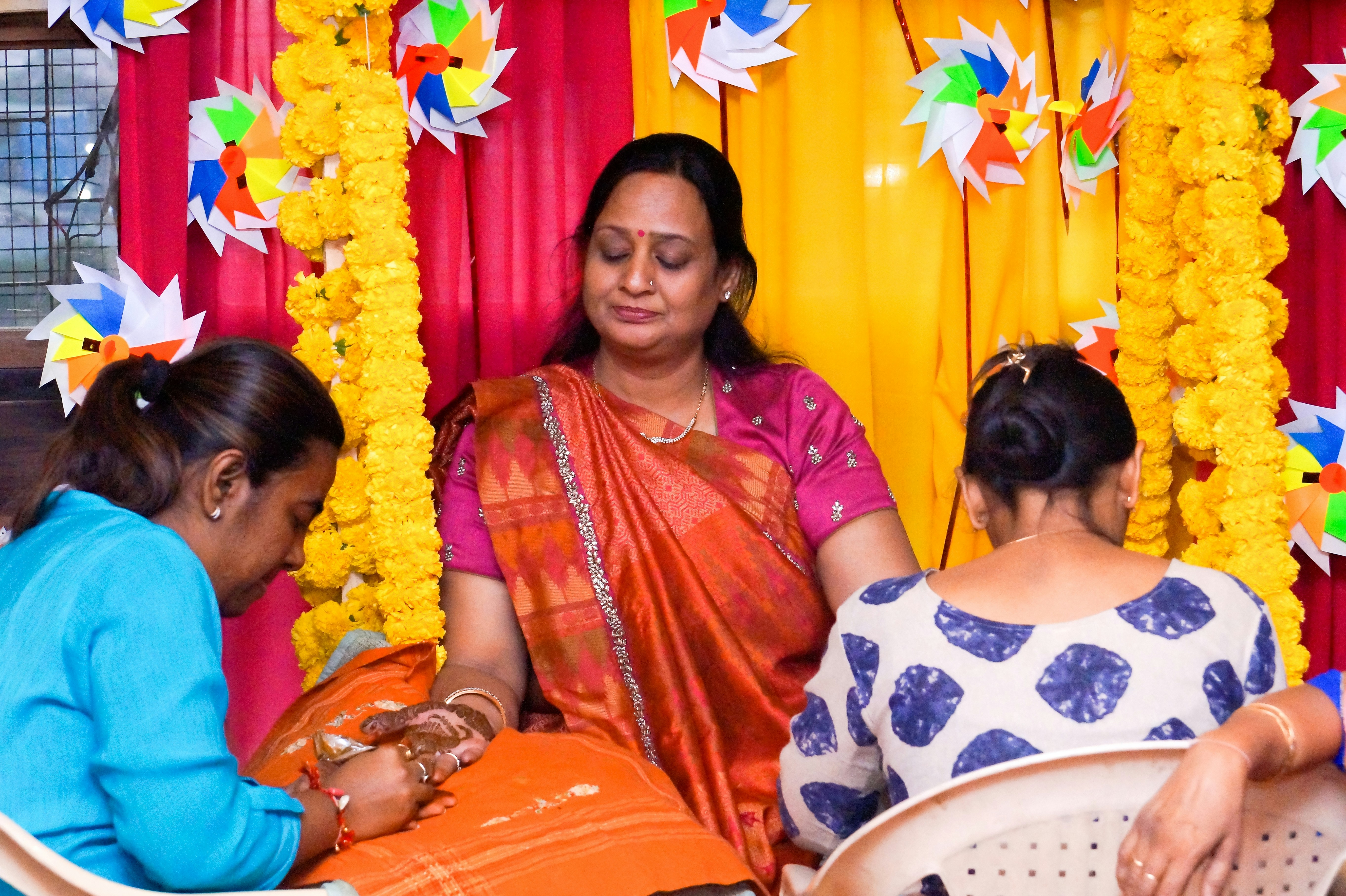 A group of women sitting next to each other