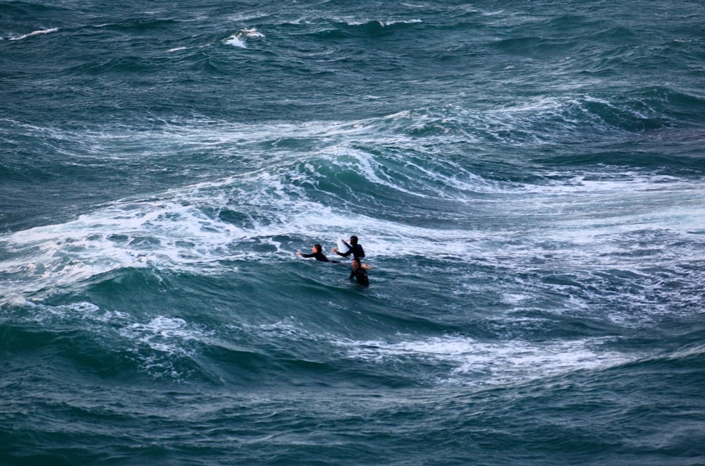 a person riding a surfboard on a wave in the ocean