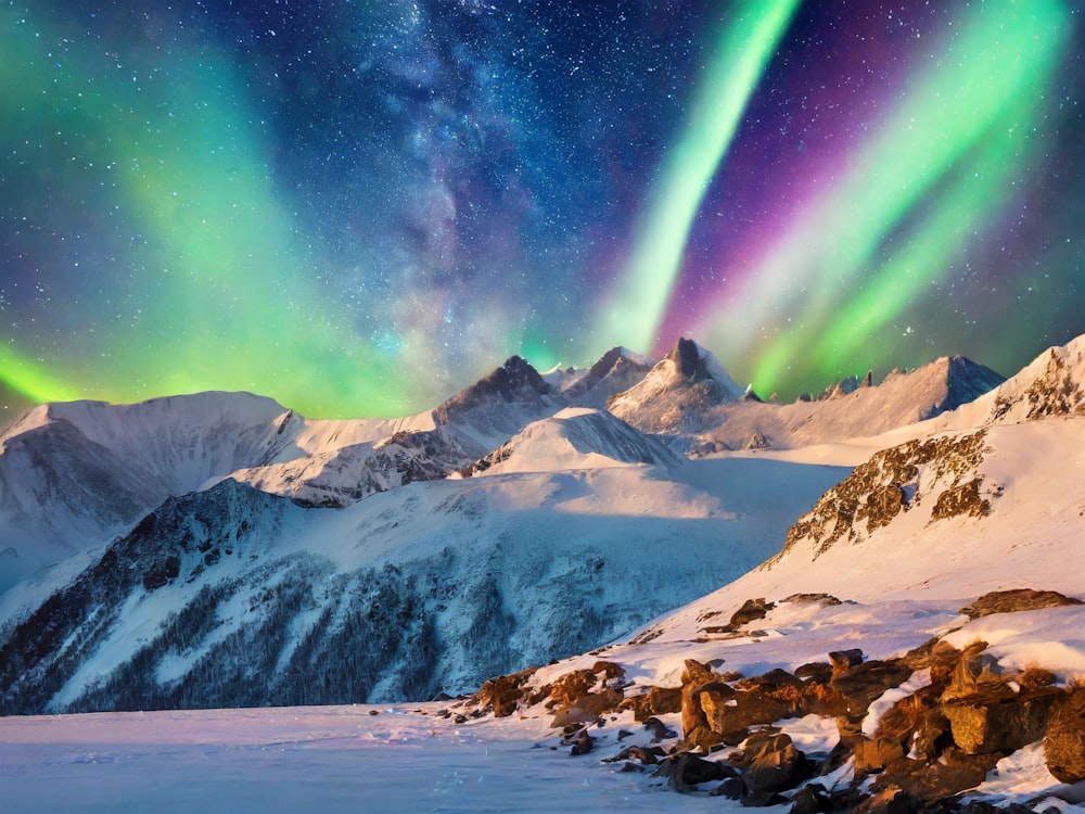 the aurora bore over a snowy mountain range