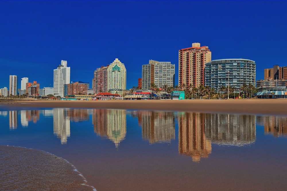 a view of a beach with a city in the background