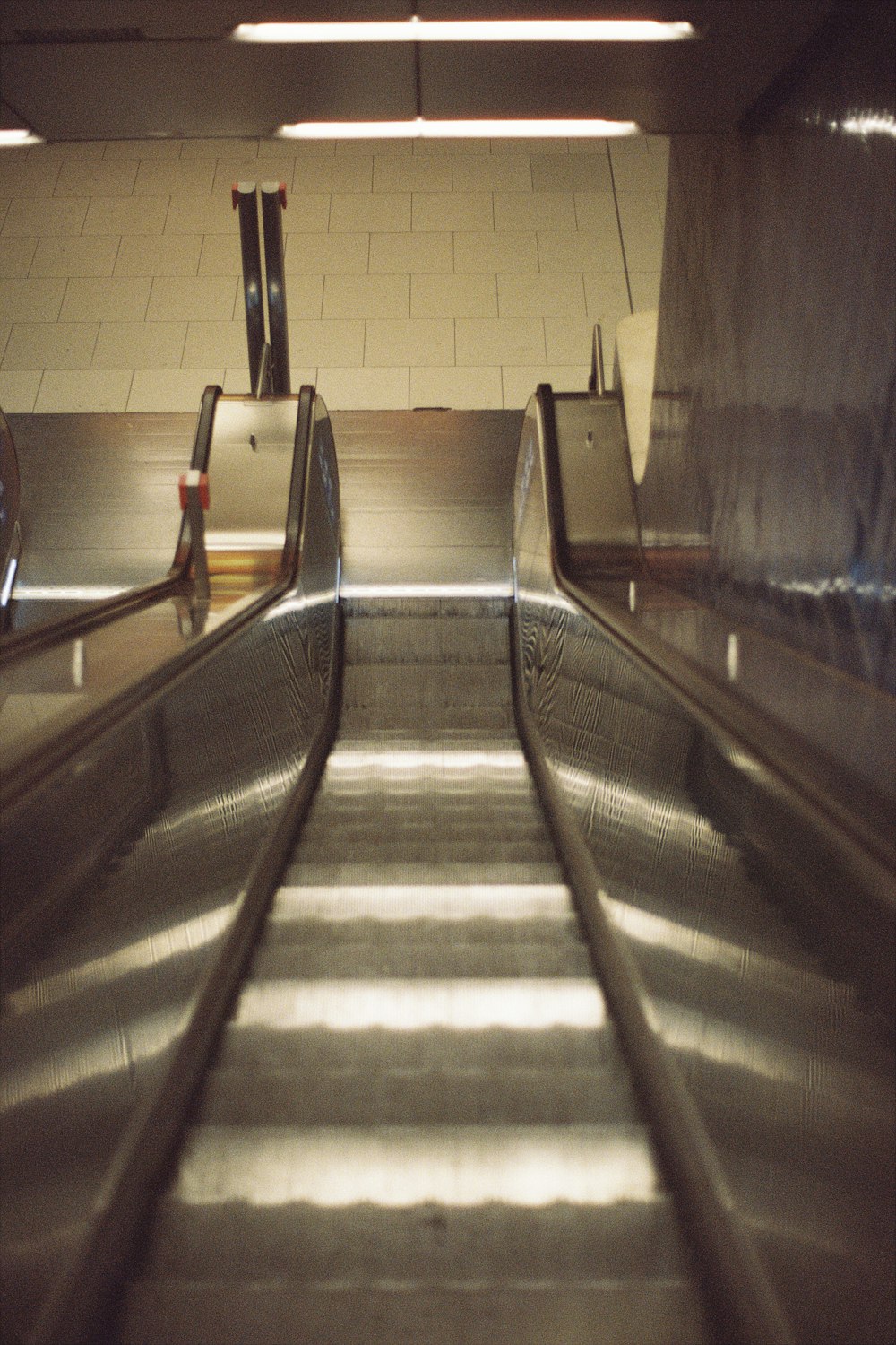 an empty escalator in a subway station