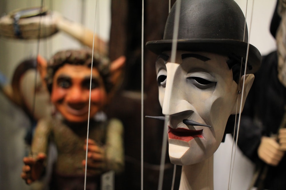 a group of masks that are on display