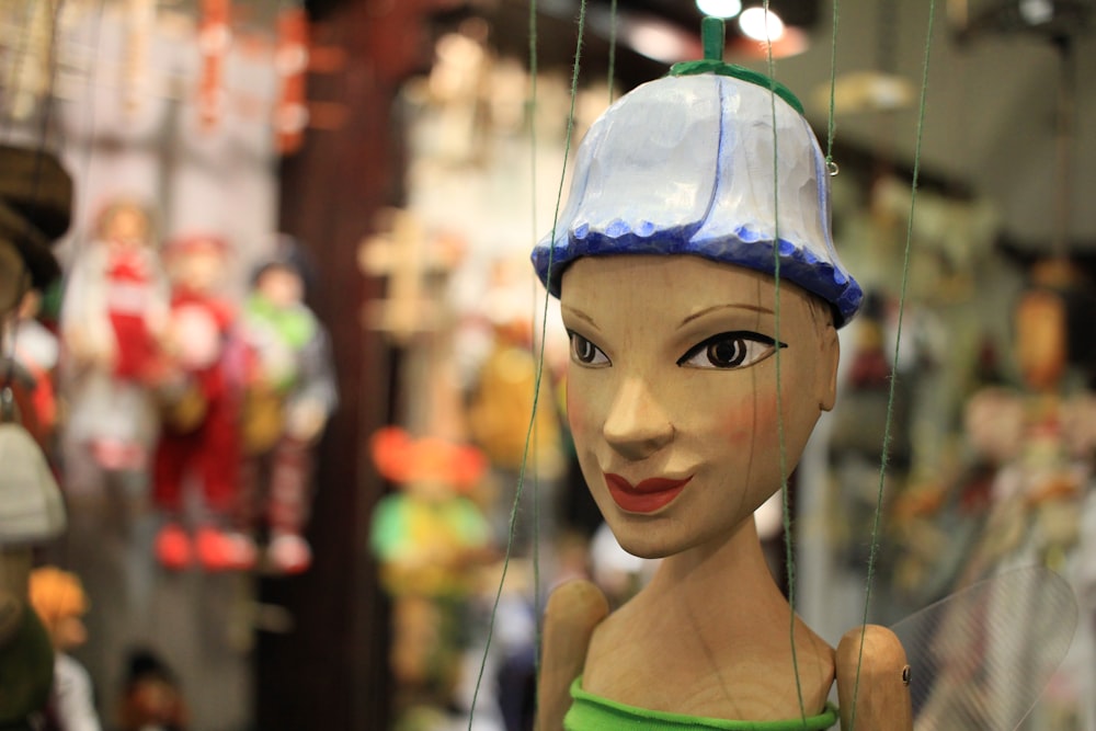 a close up of a mannequin wearing a hat