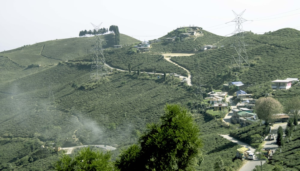 a scenic view of a village on a hill