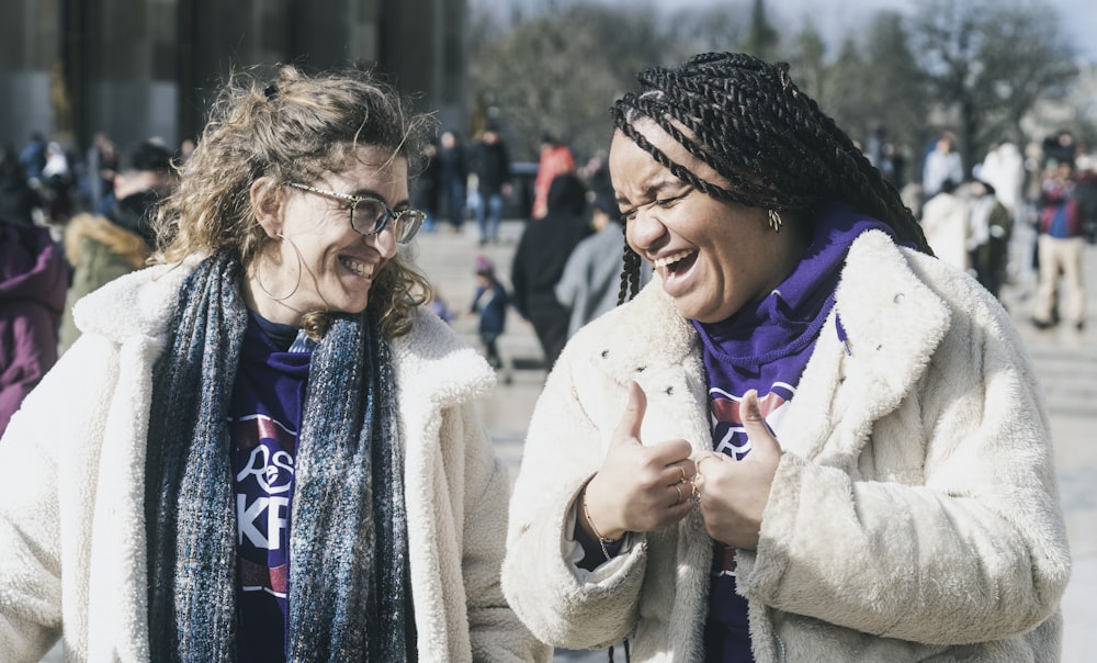 a couple of women standing next to each other