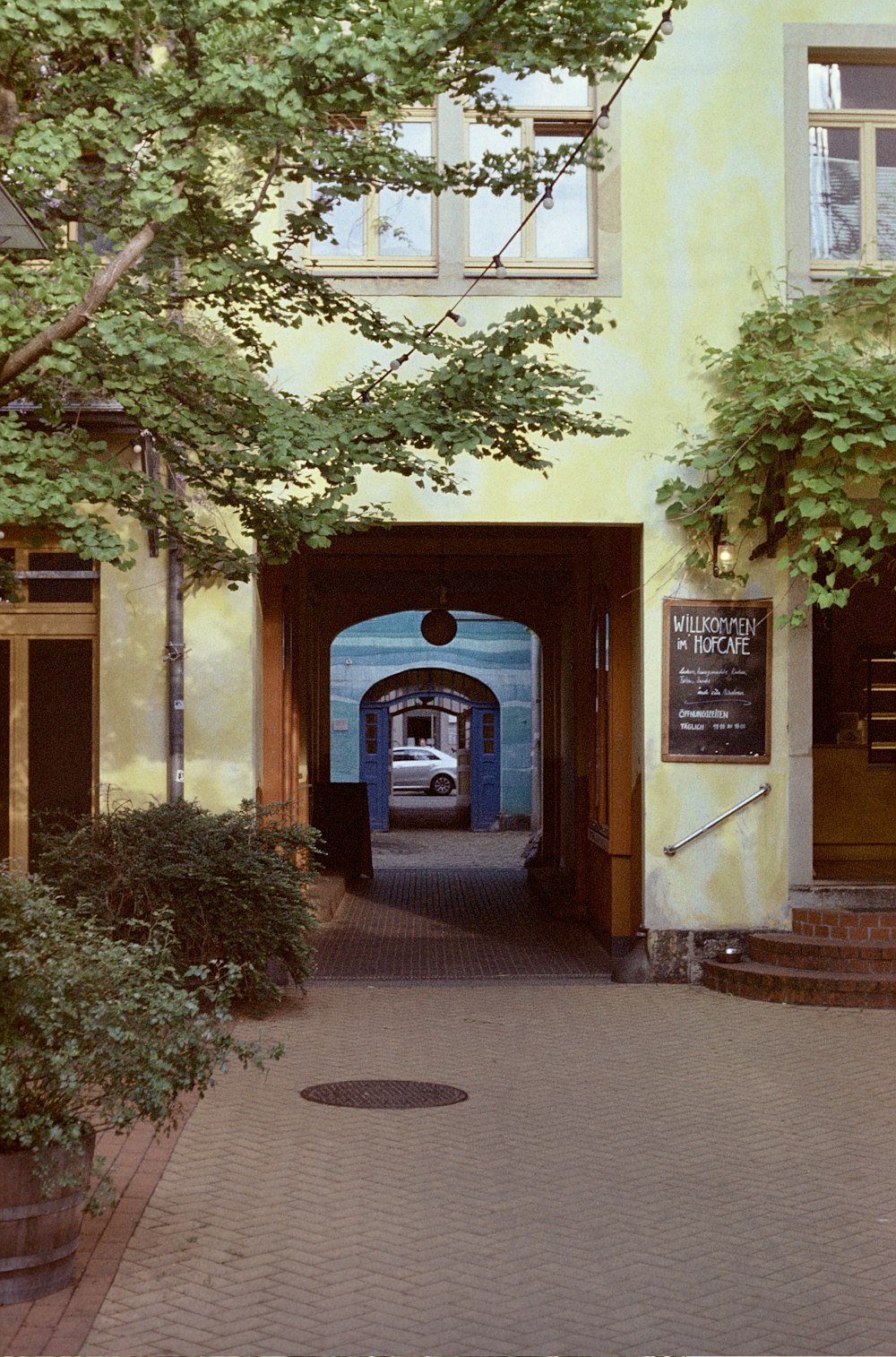 a car is parked at the entrance to a building