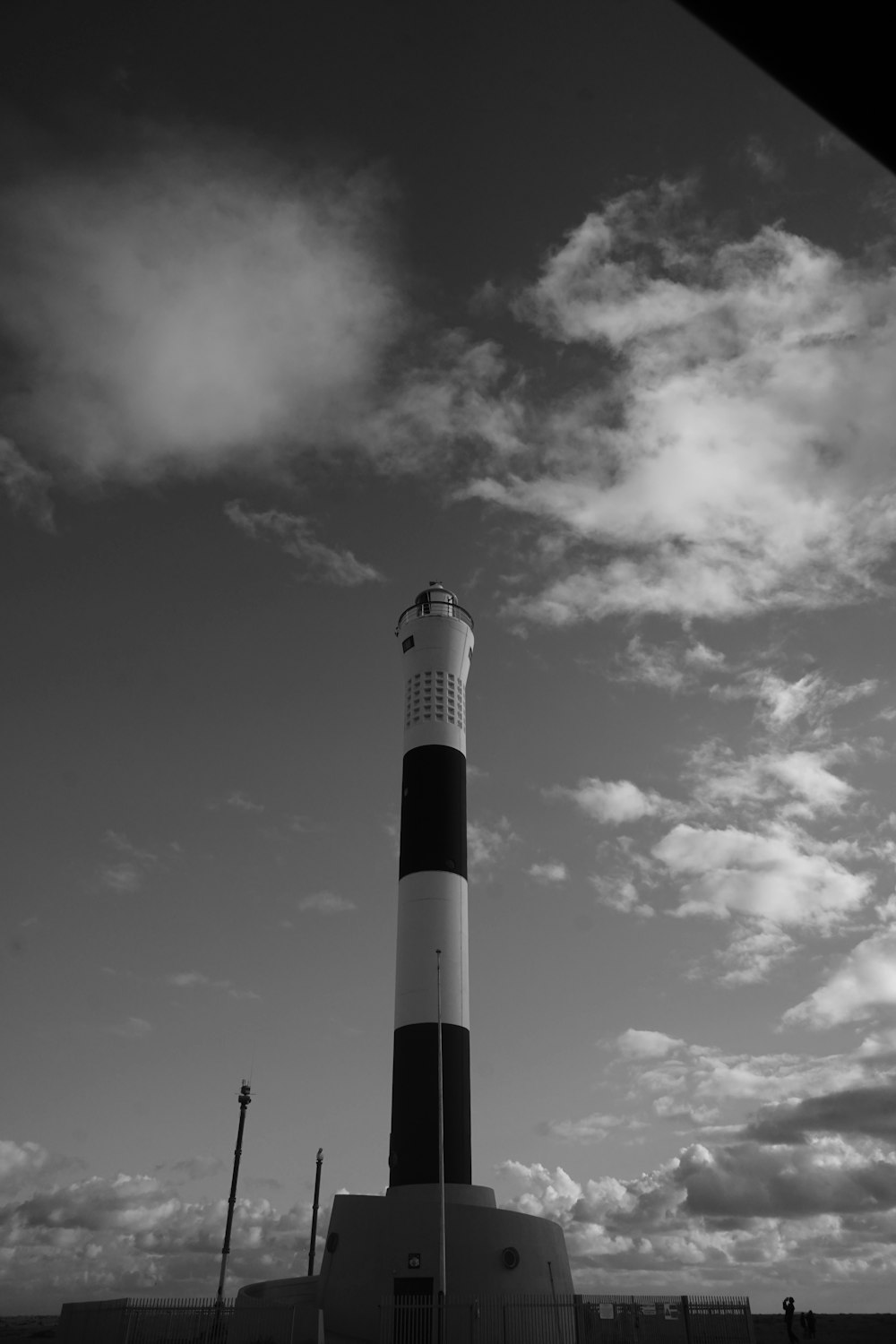 a black and white photo of a lighthouse