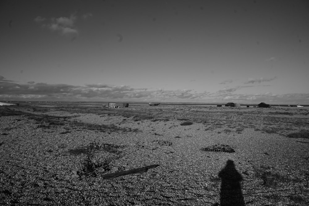 a black and white photo of a dirt field