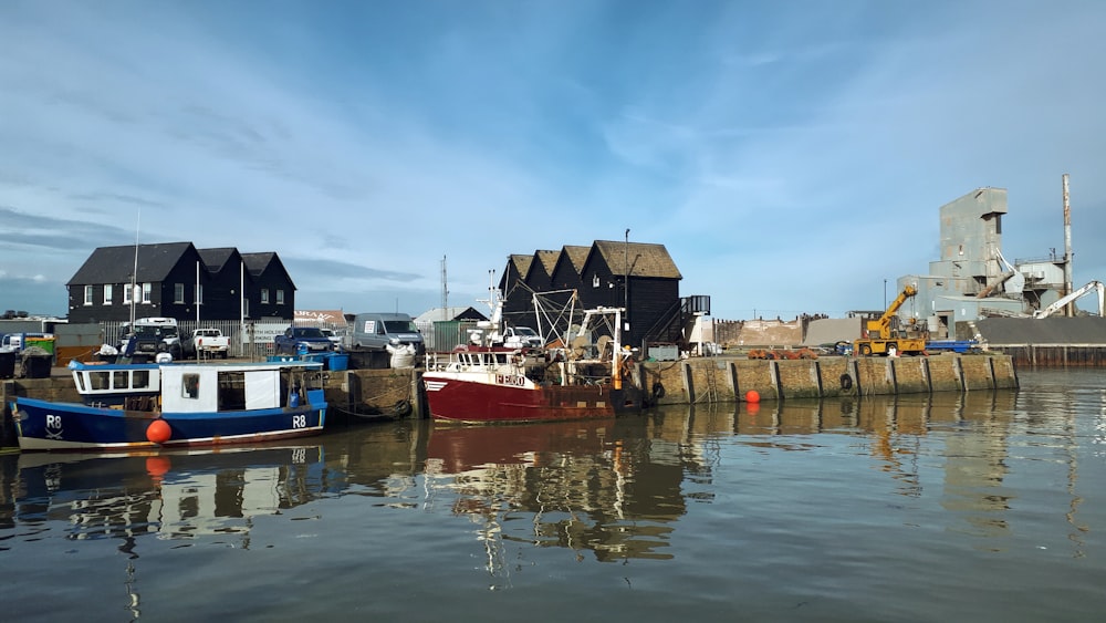 a group of boats that are sitting in the water