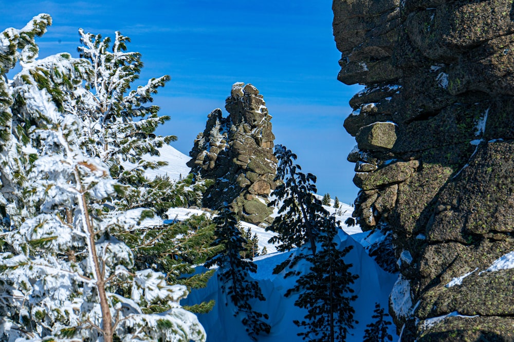 a person on skis standing on a snow covered mountain