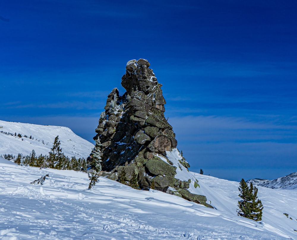 a man riding skis down a snow covered slope