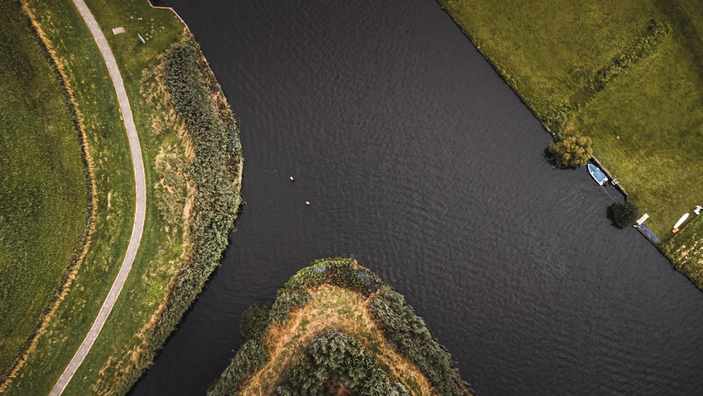 a river running through a lush green countryside