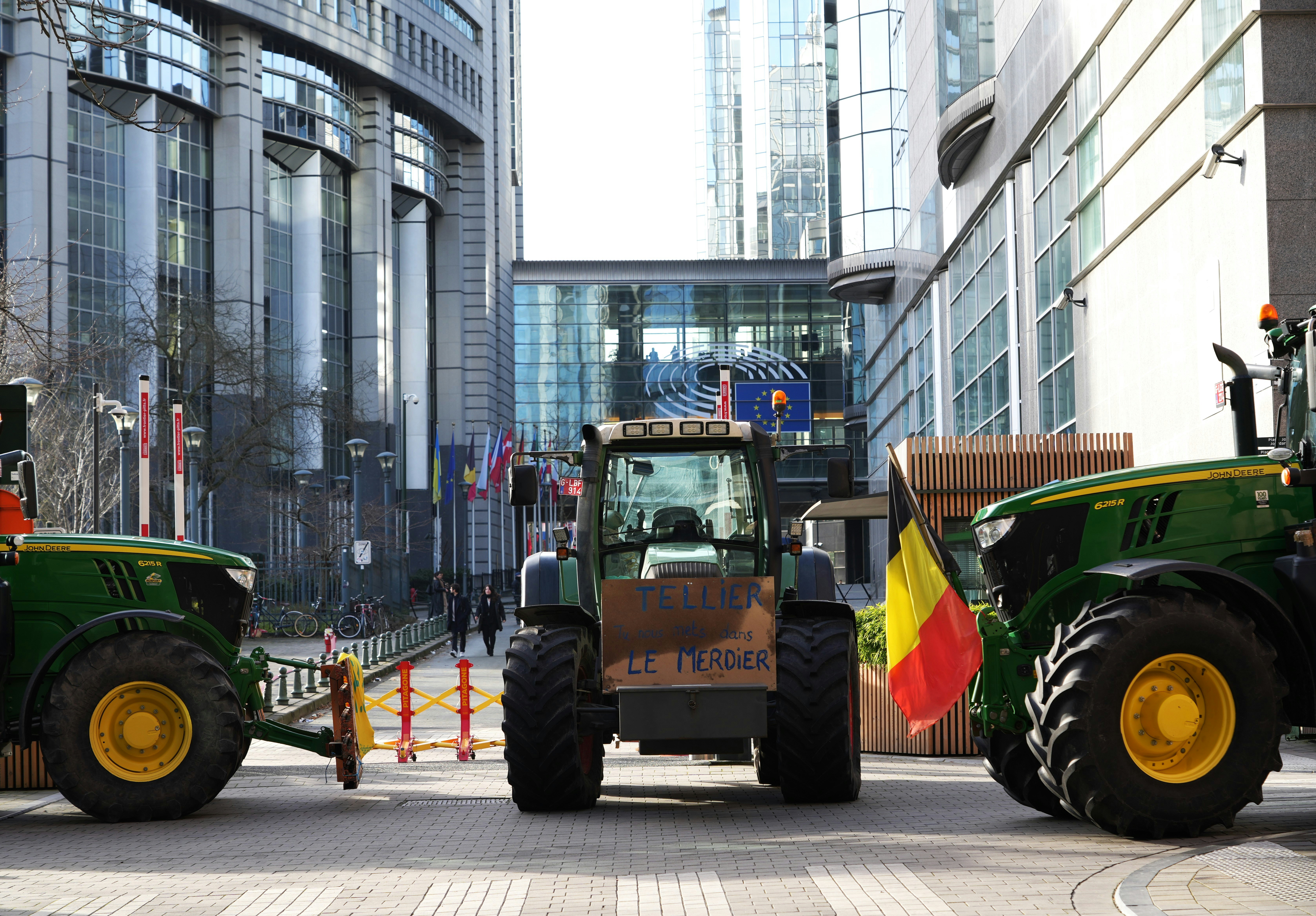 a group of tractors parked in front of a building