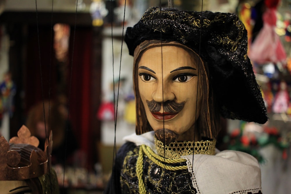 a close up of a puppet of a man with a mustache