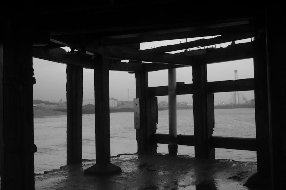 a black and white photo of a pier