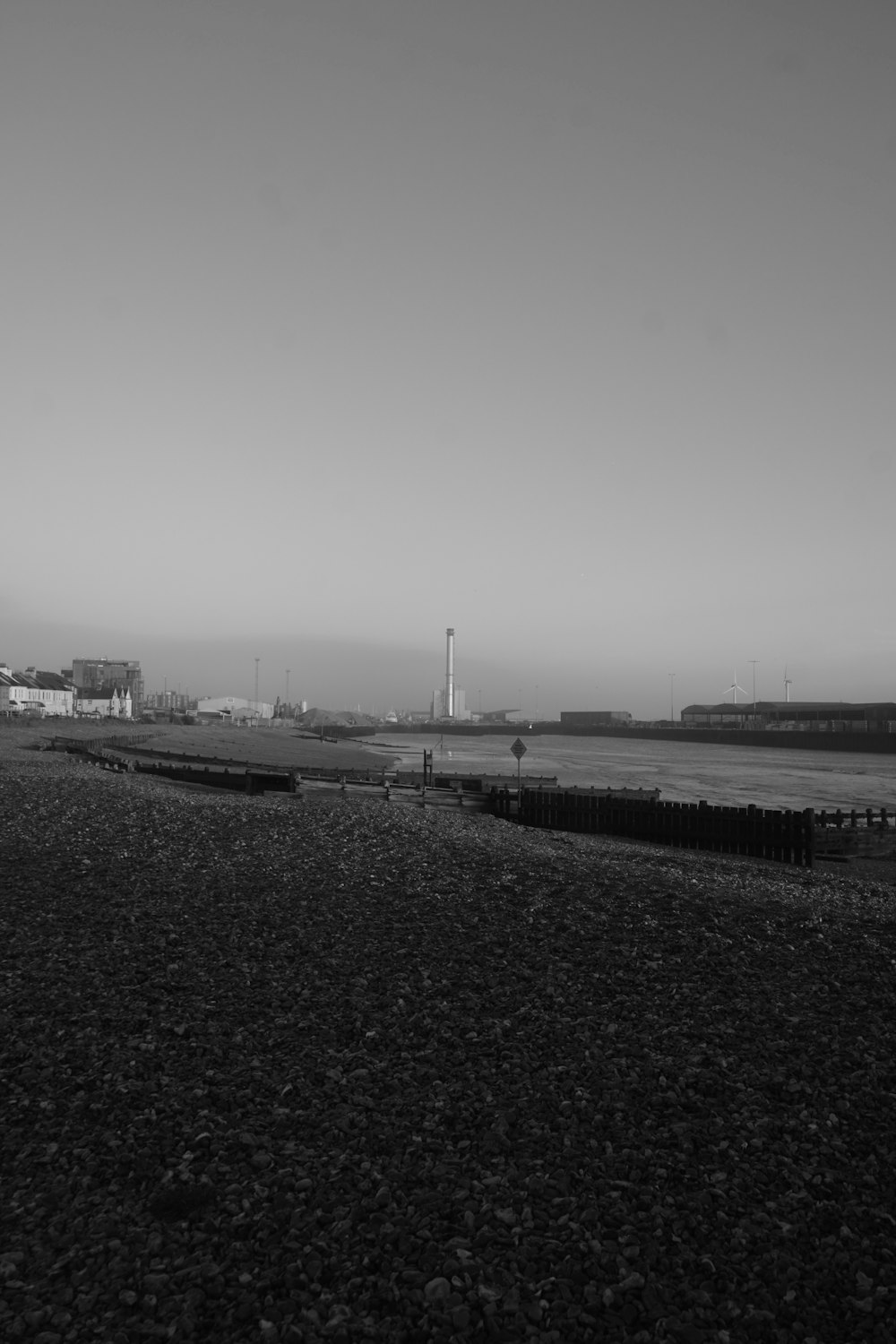 a black and white photo of a beach