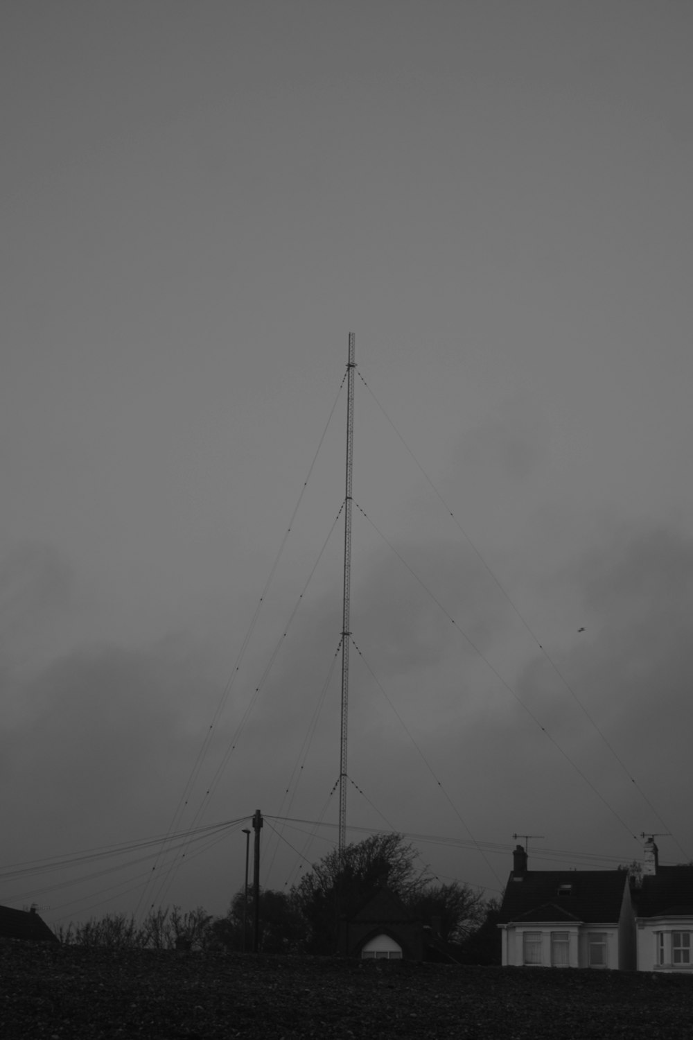 a black and white photo of a radio mast