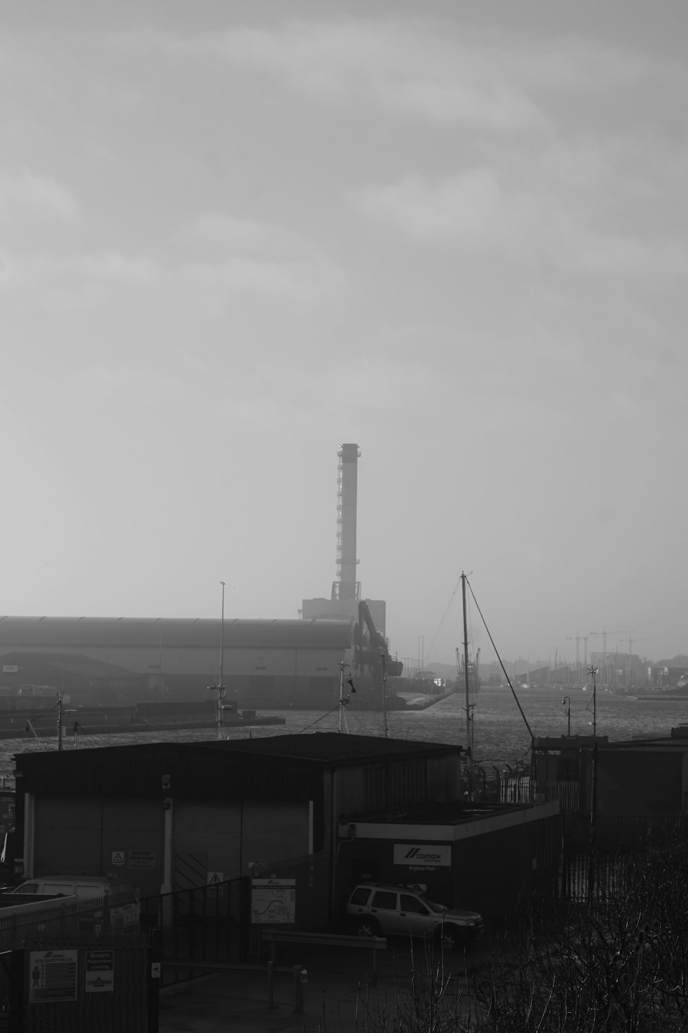 a black and white photo of a factory