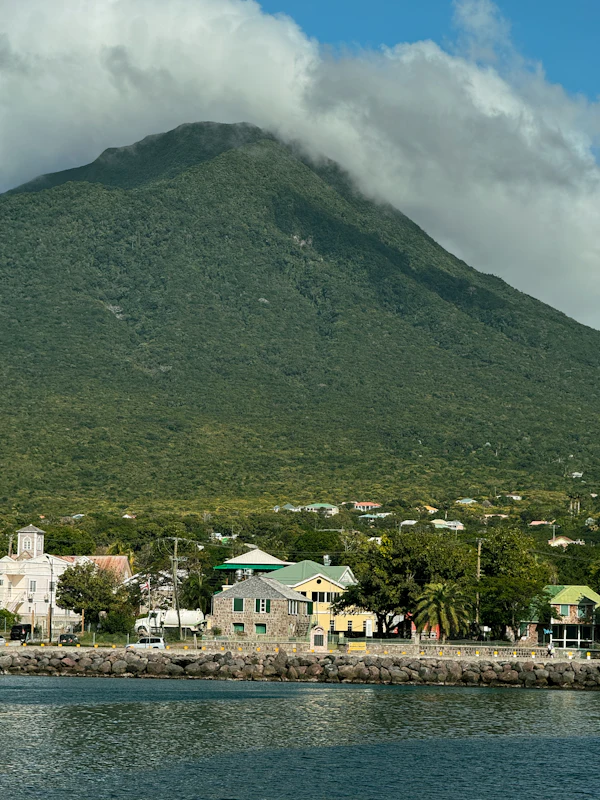 Coastal city with mountains behind